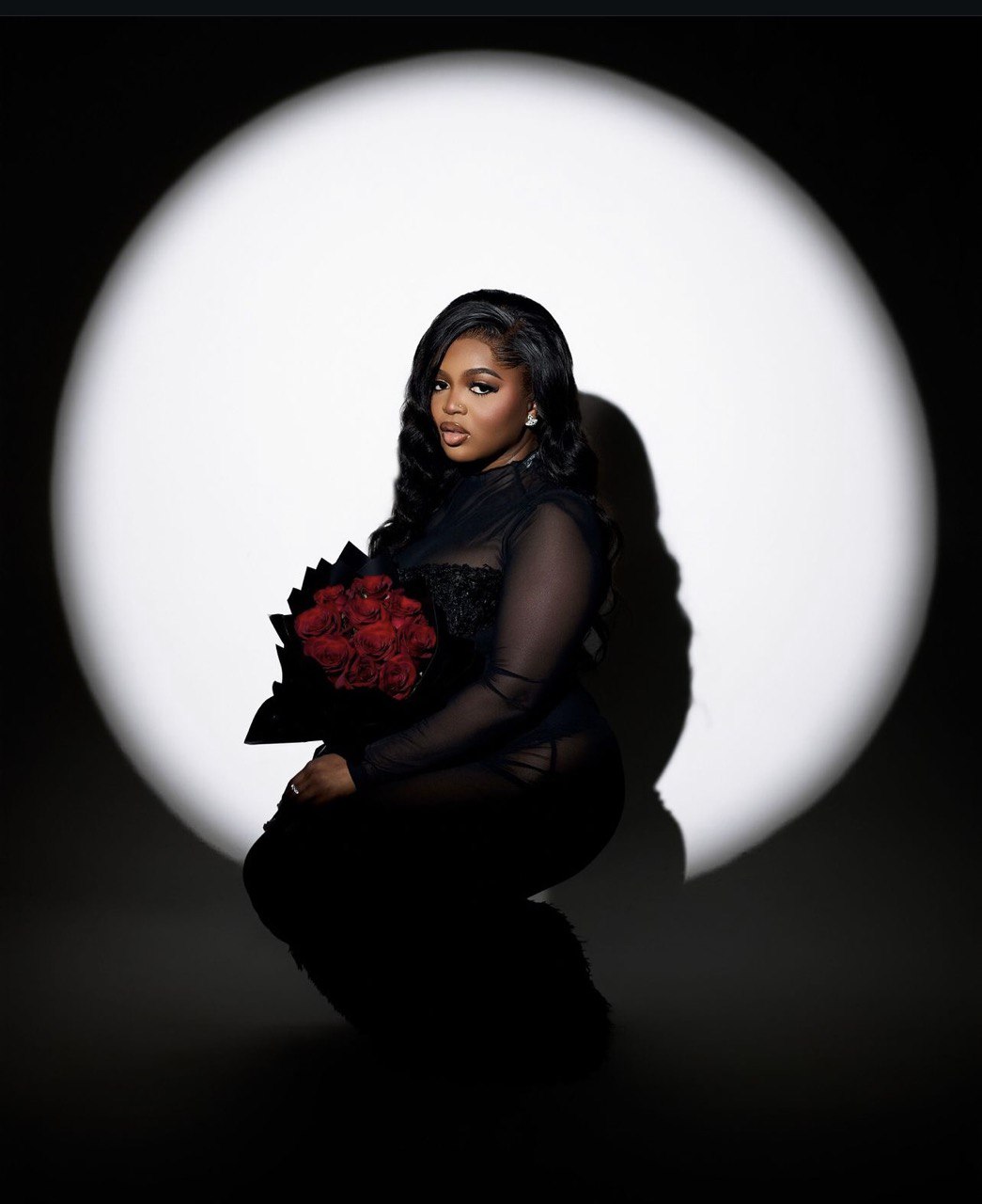 Spotlight portrait with roses